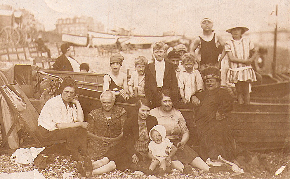 A group of people on Brighton beach circa 1930