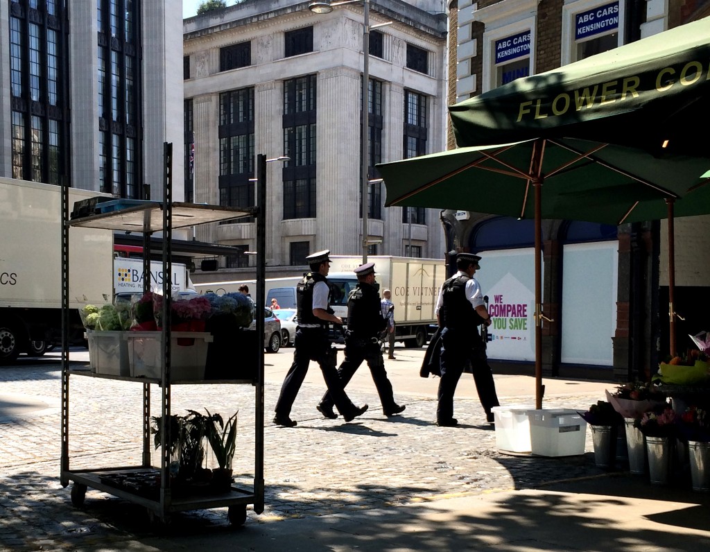 Daytime. Armed police on Kensington High Street, London. 2014