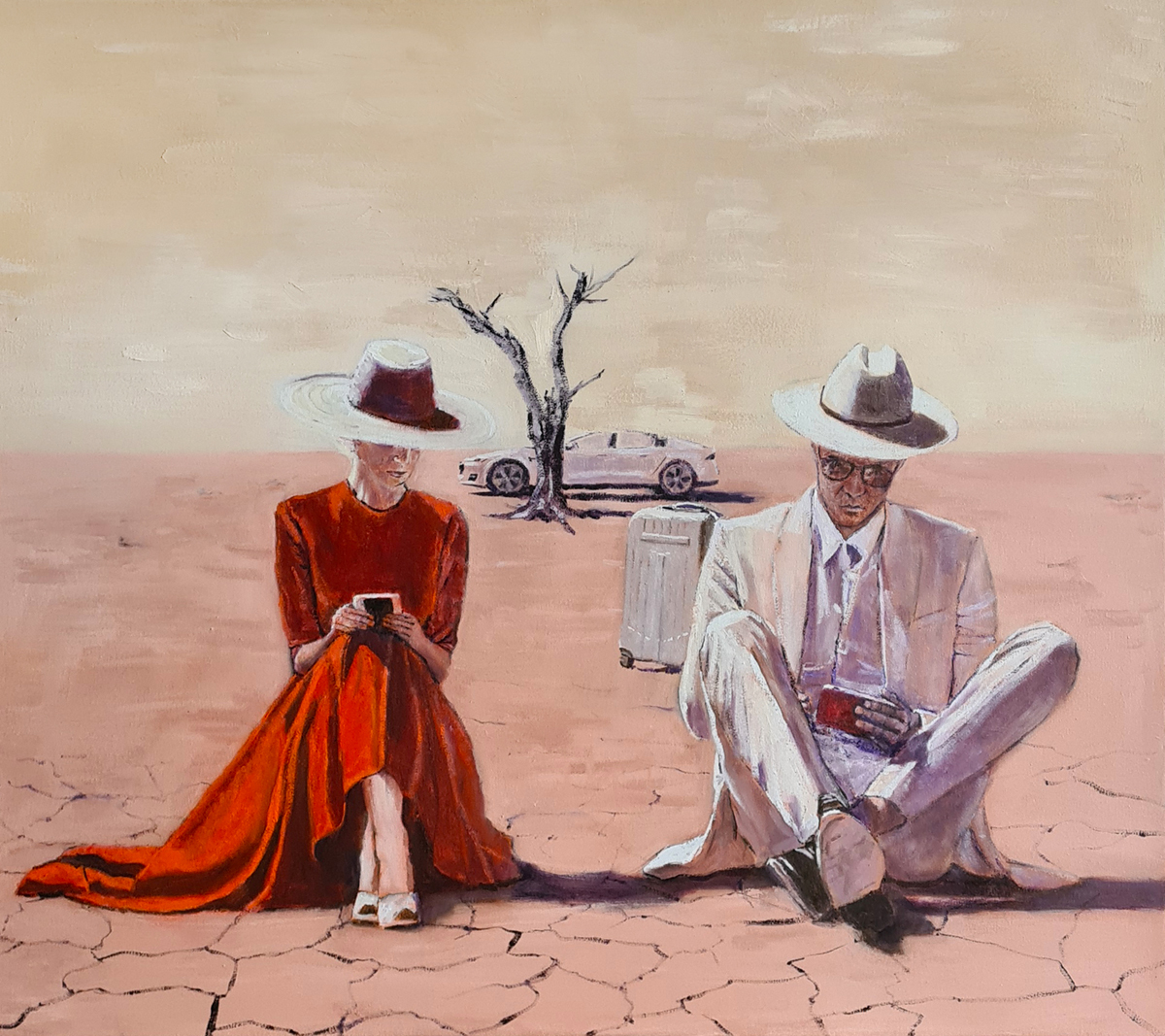 A woman and a man sit in desert while looking at their phones